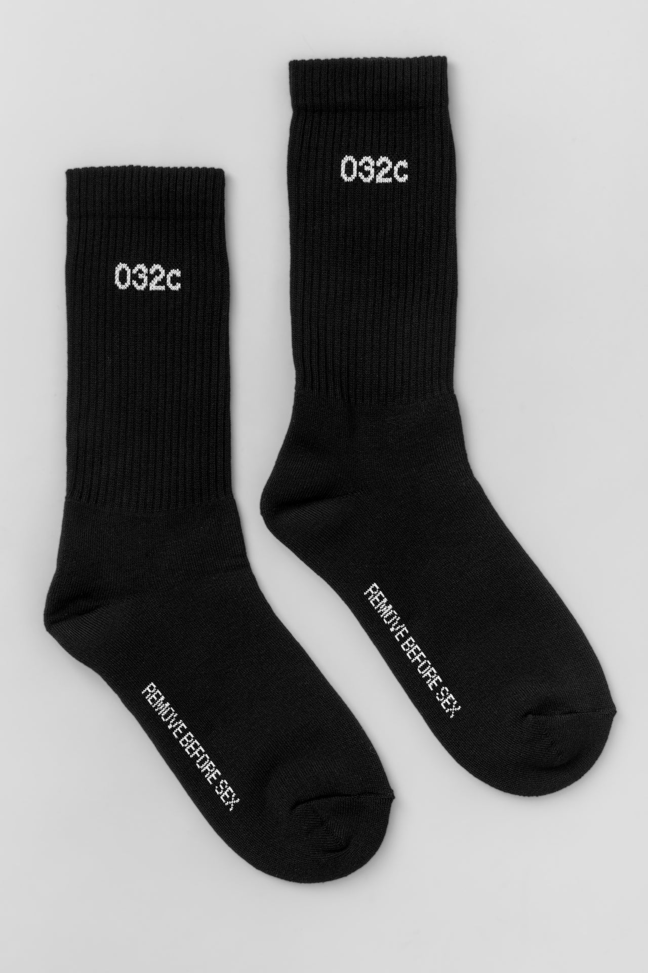 032c "REMOVE BEFORE SEX" Crew Socks Black